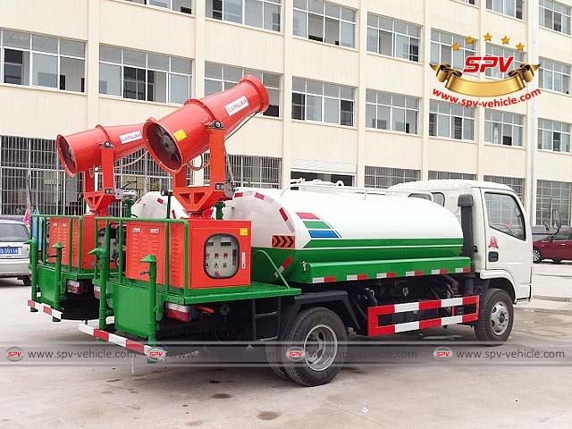 Rear right view of two more pesticide spray trucks, mosquito control trucks