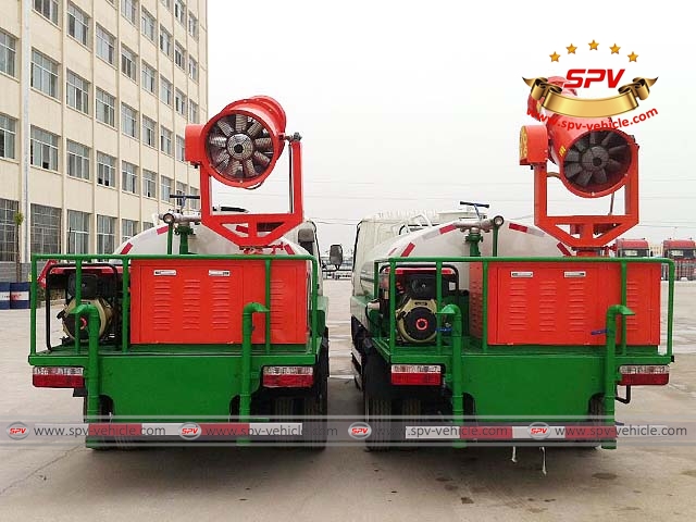 Rear view of two more pesticide spray trucks, mosquito control trucks